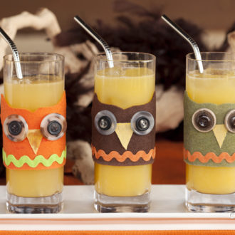 Three glasses with DIY felt owl drinking glass decorations for Halloween
