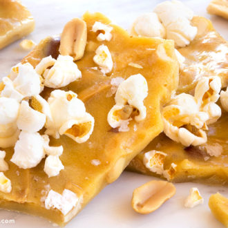 A popcorn peanut brittle crunch, broken into pieces to eat.