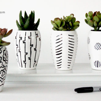 DIY ceramic centerpieces that are decorated using sharpies.