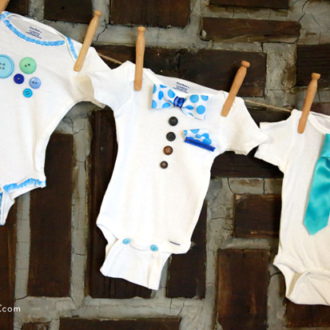 A DIY onesie bunting banner for a baby shower decoration.