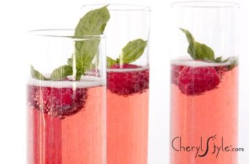 Three glasses of a refreshing basil raspberry rose champagne cocktail.