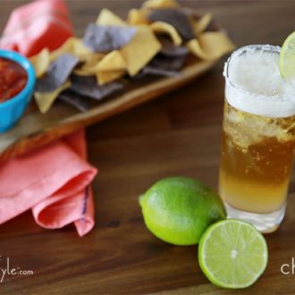 A Cinco chelada beer with lime.