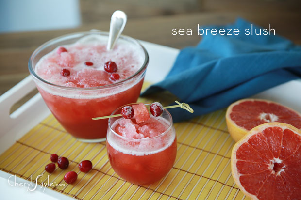 A punch bowl and a glass of a delightful frozen sea breeze slush.