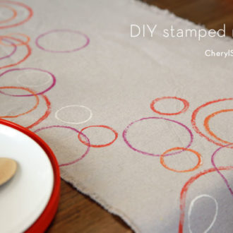 A DIY stamped drop cloth table runner. An easy craft for your table.