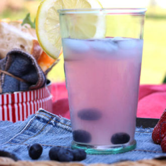 A glass of refreshing homemade blueberry lemonade.