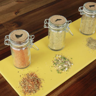Three jars of grilling spices.