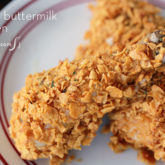 A plate of moist baked buttermilk chicken with cornflakes and homemade seasonings