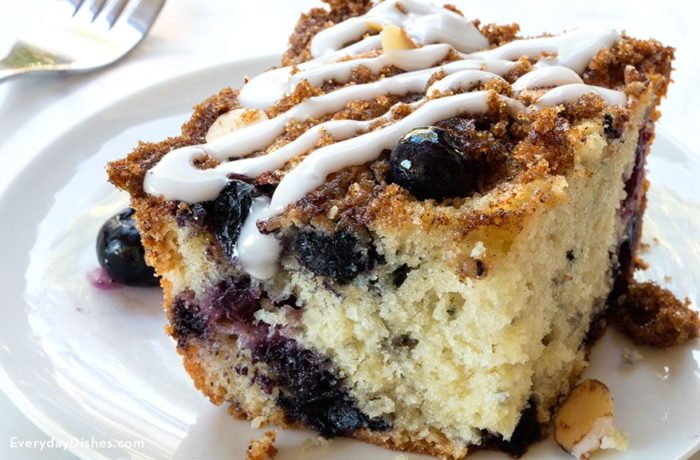A slice of blueberry coffee cake on a plate.