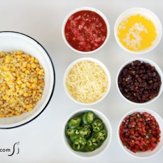 A fresh corn bar with toppings in individual bowls.
