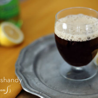 A glass of a dandy shandy stout beer cocktail.