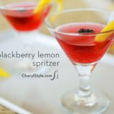 Two glasses of a refreshing blackberry lemon spritzer.