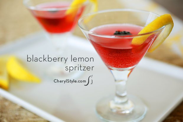 Two glasses of a refreshing blackberry lemon spritzer.