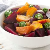 A bowl of roasted beet salad with goat cheese, the perfect side dish.