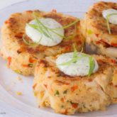 A plate of baked crab cakes, ready to serve