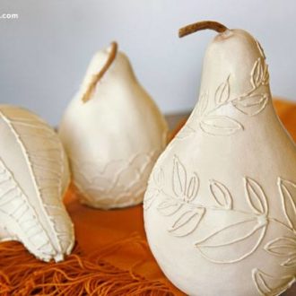 Gourds that are glue-decorated to make a cute fall centerpiece.