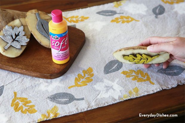 Use potatoes and free printable to create a leaf stamped table runner