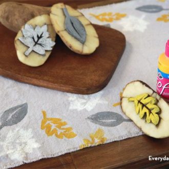 Potatoes and free printable created this DIY leaf-stamped table runner.
