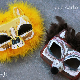 Two DIY animal face masks that were made from an egg carton.