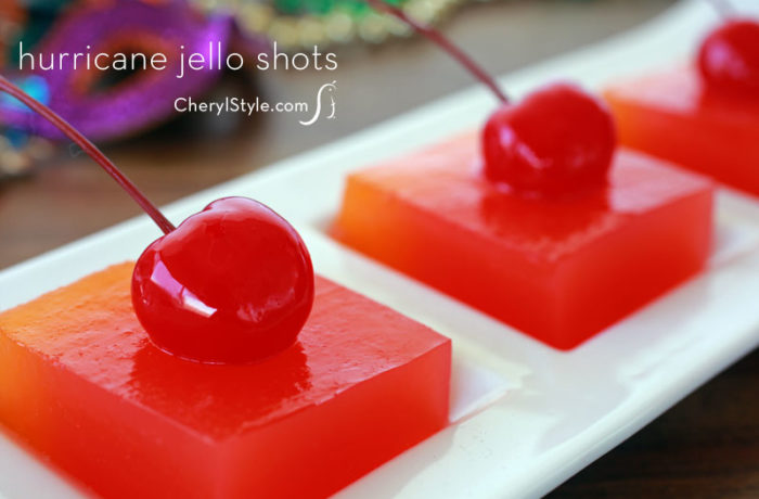 Several delicious hurricane jello shots, topped with cherries.