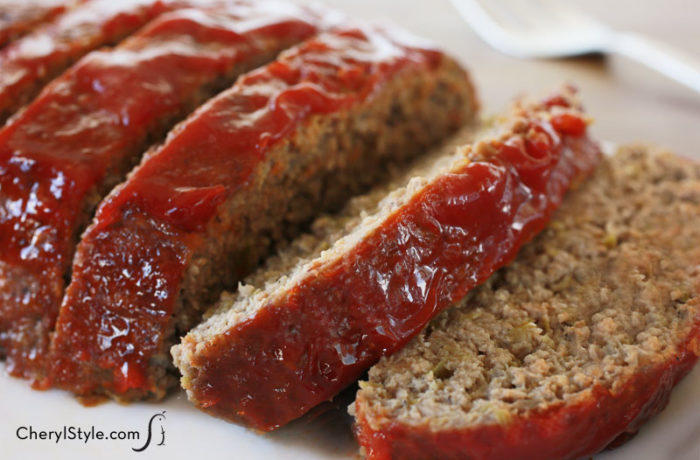 The best homemade meatloaf ever—super moist with minced veggies, it's sliced and ready to have for dinner.