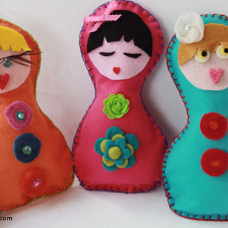 Some DIY felt dolls made using a blanket stitch.
