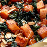 A skillet with butternut squash and kale — the perfect side dish.
