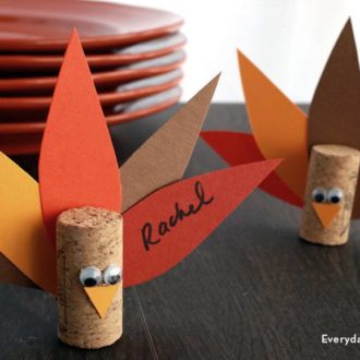 DIY turkey place card holders using wine corks — a fun Thanksgiving decoration.
