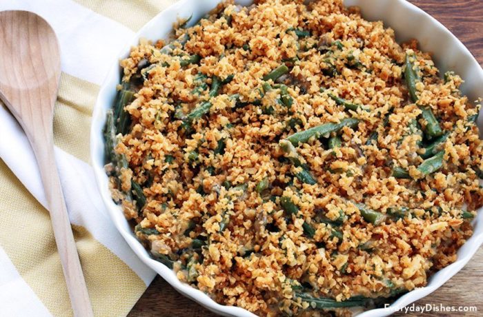 A pan full of a fresh green bean casserole, ready to serve as a side dish.