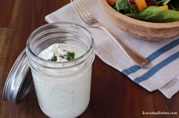 A jar of homemade buttermilk ranch dressing that's perfect for salads.