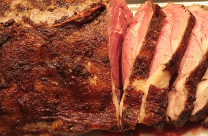 Mouthwatering prime rib roast that's sliced and ready to serve.
