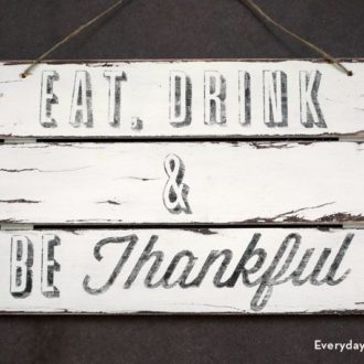 DIY rustic wall art — a sign that says "Eat, Drink, & Be Thankful."