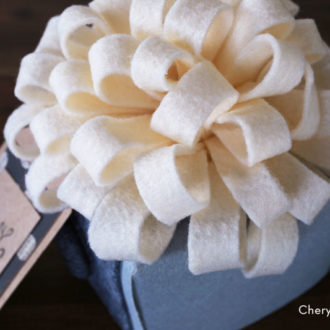 A present that's topped with a DIY felt bow — an inexpensive way to spruce up any gift!