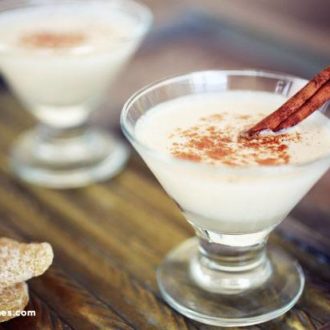 Two glasses of spiced gingerbread martinis, a refreshing holiday cocktail.