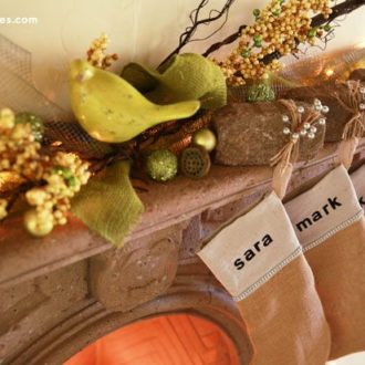 A rustic mantle with DIY paver stone stocking hangers for Christmas.