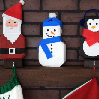 DIY penguin, snowman, and Santa Christmas stocking holders.