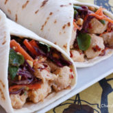 Two Thai chicken tacos, ready to eat and bring a yummy new flavor to the usual wrap.