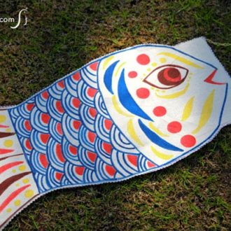 An easy, no-sew DIY fish windsock craft made with canvas and fabric markers