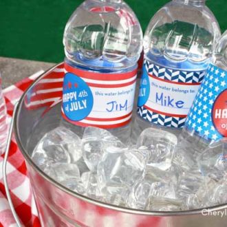 Water bottles with DIY printable labels on them for the 4th of July to keep your guests from losing with a water bottle.