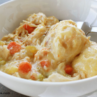 A bowl with a serving of delicious slow cooker chicken and dumplings.