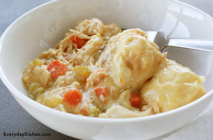 A bowl with a serving of delicious slow cooker chicken and dumplings.