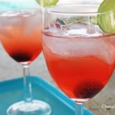 Two glasses of a refreshing and simple vanilla cherry limeade cocktail.