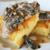 Crispy polenta with mushroom sauce that's ready to eat for dinner.