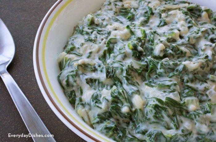 A bowl full of creamed spinach