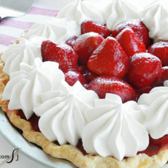 A delicious homemade fresh strawberry pie that's ready to serve for dessert.