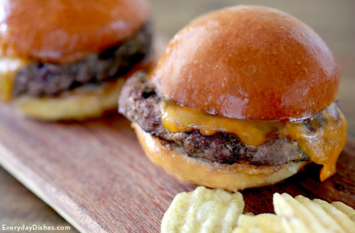 Hamburgers made using homemade buns that are ready to serve.
