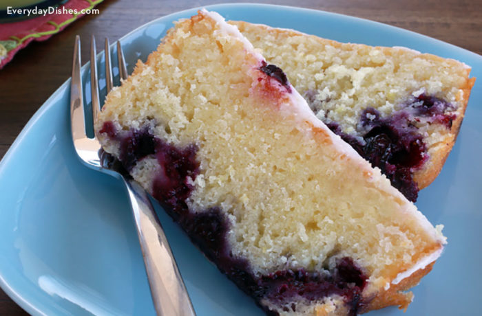 Two slices of lemon blueberry bread on a plate, ready to enjoy.