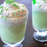 Two glasses of a lucky lime float, a non-alcoholic dessert drink that's perfect for St. Paddy's Day.