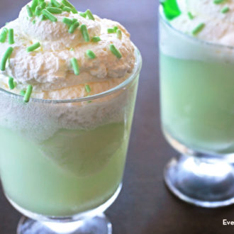 Two glasses of a lucky lime float, a non-alcoholic dessert drink that's perfect for St. Paddy's Day.