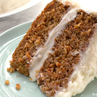 A slice of a delicious and moist carrot cake.