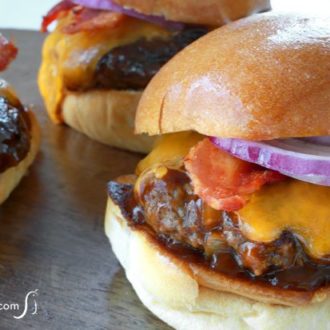 Bite into a smoky whiskey BBQ burger with thick cut bacon and cheddar!